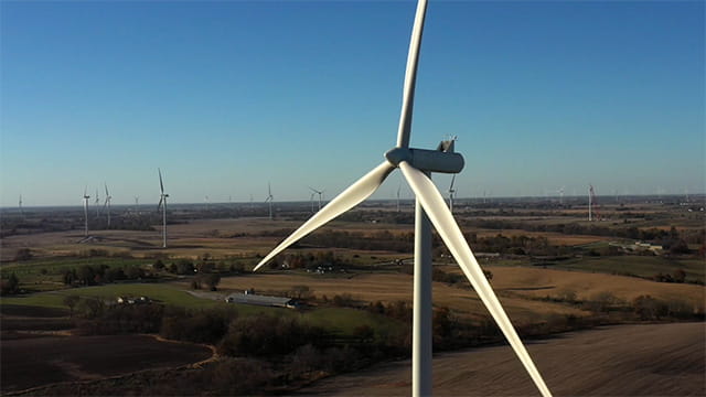 Wind turbines in a field. 