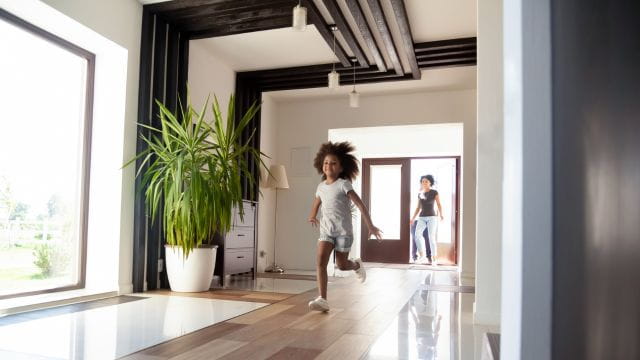 child running through a house